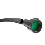 Cut end of black soaker hose beside a female connector with green flow disc