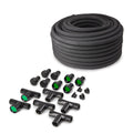 Coiled black soaker hose with assorted tee fittings, connectors, caps and green flow inserts