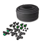 Coiled black soaker hose with assorted tee fittings, connectors, caps and green flow inserts