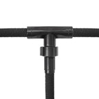 Close-up of three soaker hose sections joined by a black tee fitting