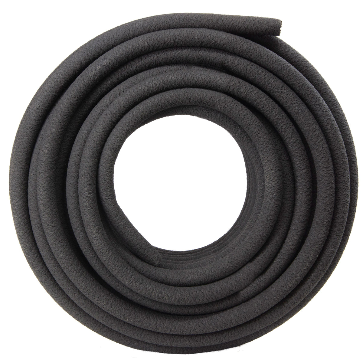 Overhead view of a loose coil of black soaker hose