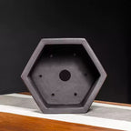 Hexagonal pot interior with central drainage hole