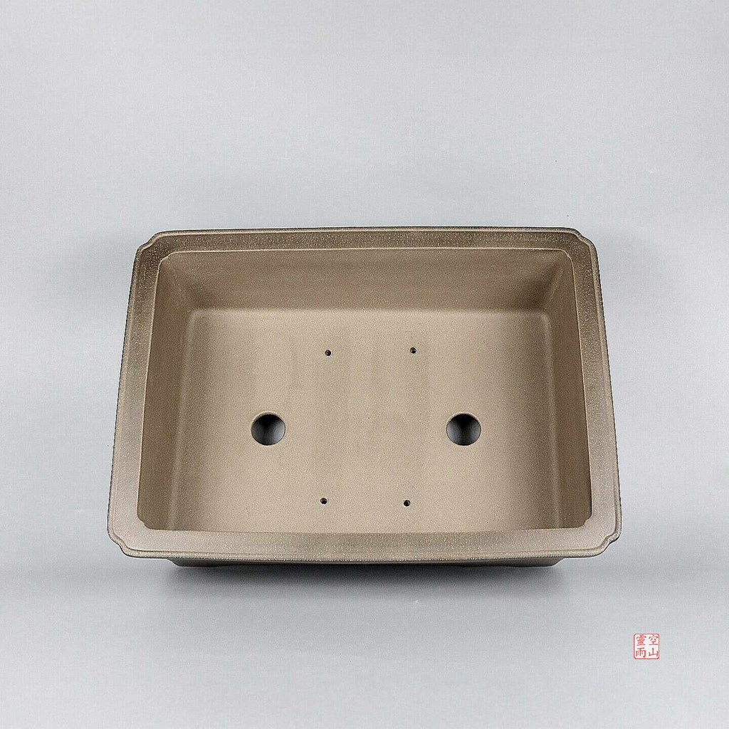 Top view of taupe rectangular pot showing two large openings and four small holes