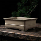 Taupe rectangular bonsai pot with horizontal band and notched base