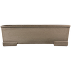 Isolated front view of taupe rectangular pot with block feet