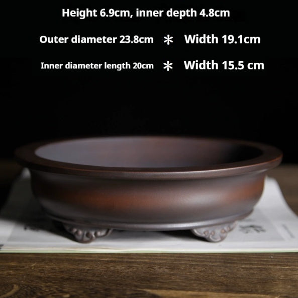 Brown oval pot with exterior and interior dimension labels