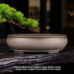 Taupe oval pot displayed on wood with dimension annotations