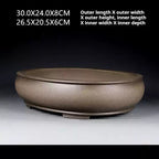 Side view of the taupe oval pot with measurement labels