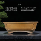 Ochre oval pot with measurement labels above