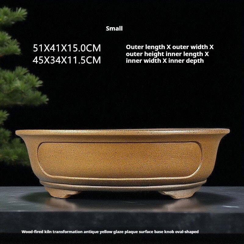 Ochre oval pot with measurement labels above
