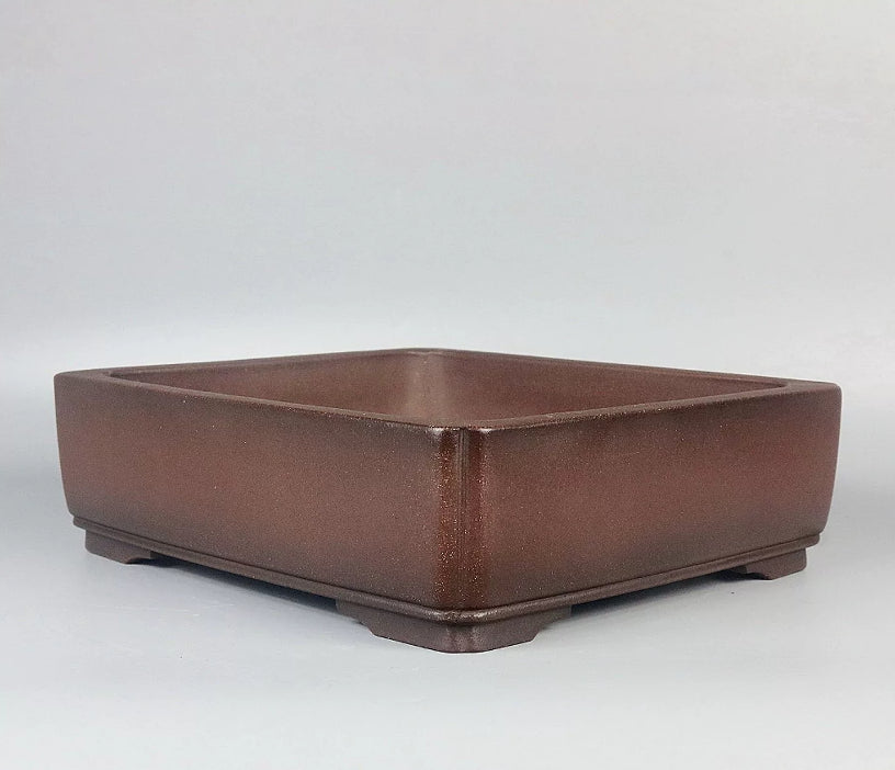 Angled view of the plain brown rectangular pot