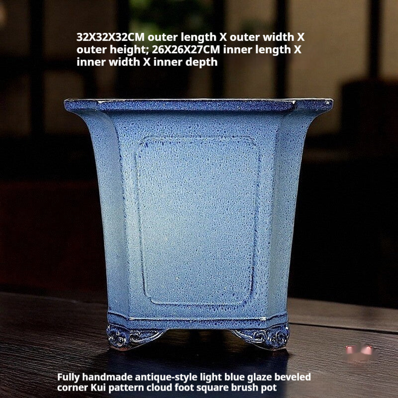 Tall light blue square pot with recessed panels, decorative feet and exterior and interior measurement labels