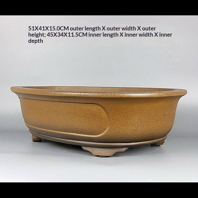 Angled ochre oval pot with measurement labels