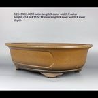 Angled ochre oval pot with measurement labels