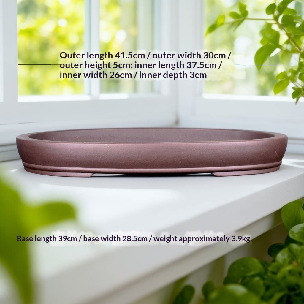 Brown oval bonsai pot with exterior and interior measurement labels