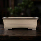 Front profile of taupe rectangular pot with horizontal band