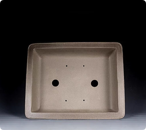 Rectangular clay pot interior with two drainage openings