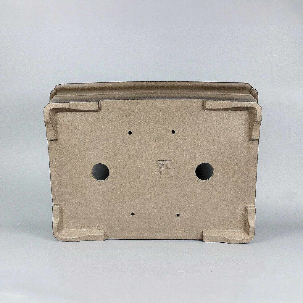 Underside of taupe rectangular pot showing openings and corner feet