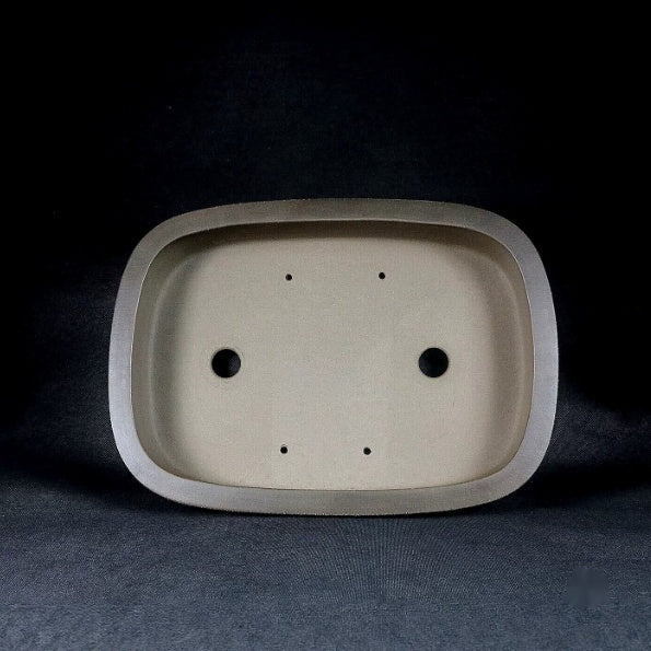 Interior of the rounded rectangular pot with two drainage holes