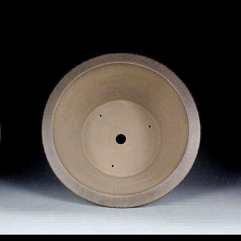 Interior of the deep taupe pot with central drainage opening