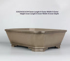 Corner-cut rim and raised feet of taupe rectangular pot