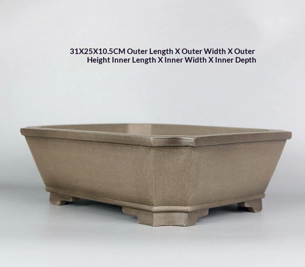 Corner-cut rim and raised feet of taupe rectangular pot