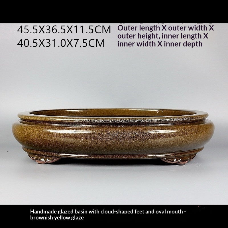 Side profile of glazed oval pot with measurement labels