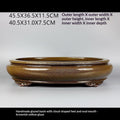 Side profile of glazed oval pot with measurement labels