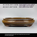 Side profile of glazed oval pot with measurement labels
