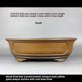 Front view of ochre oval pot with measurement labels