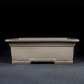 Gray rectangular bonsai pot with broad rim and notched base