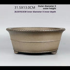 Side profile of taupe round bonsai pot with measurement labels