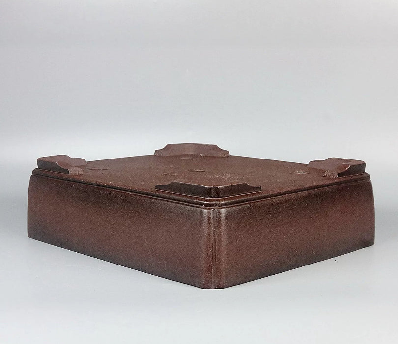 Angled underside view of the brown rectangular pot