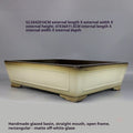 Angled ivory-glazed pot with exterior and interior size annotations