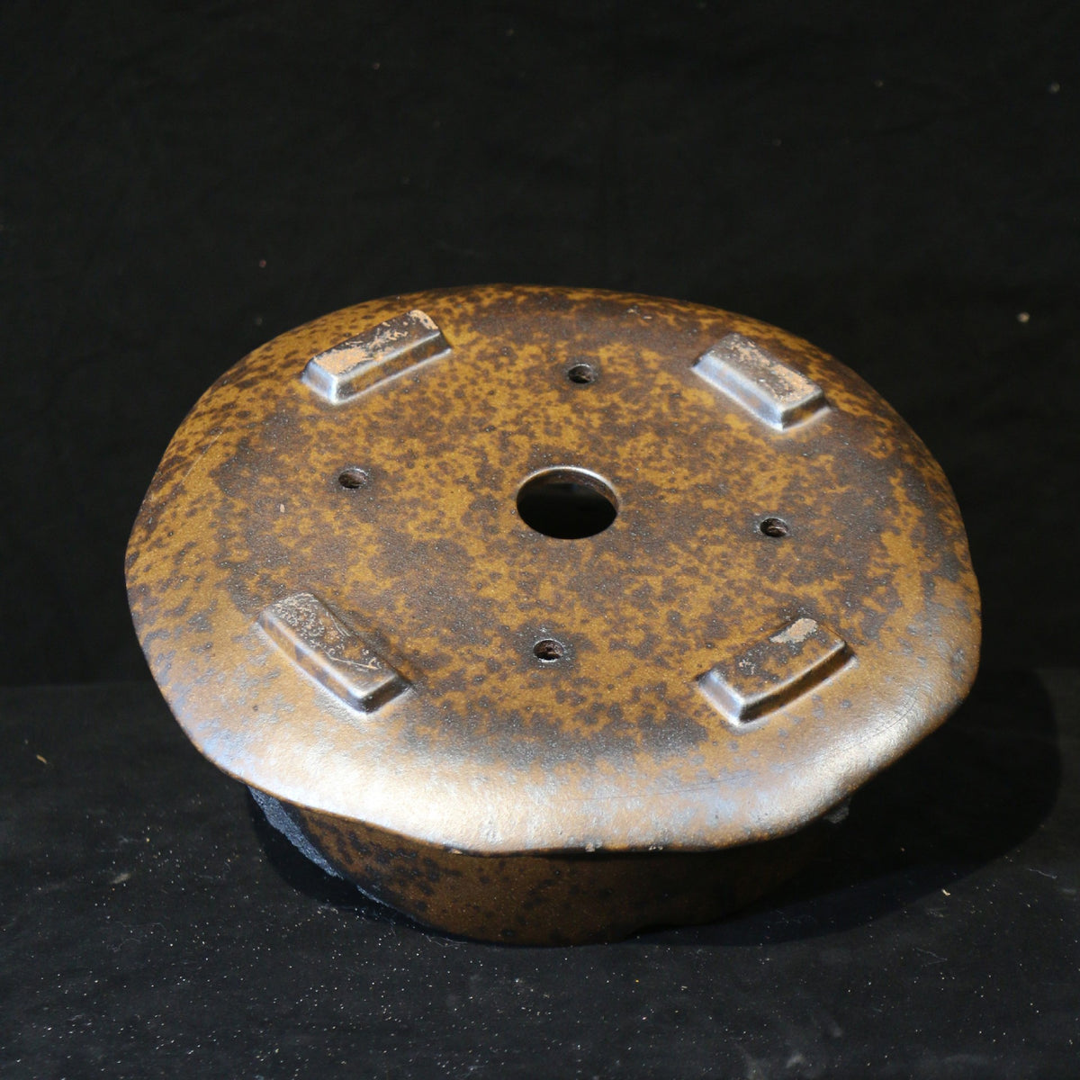 13" Round Yixing Zisha Clay Bonsai Pot - Bronze & Charcoal Glaze — underside with drainage and tie-down openings