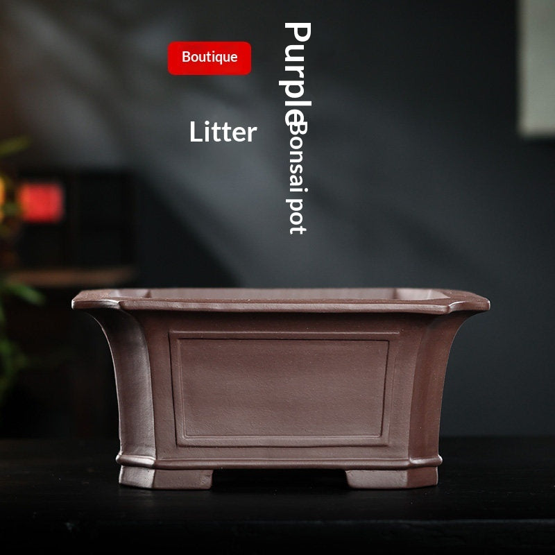 Flared rim and recessed panels of rectangular Zisha bonsai pot