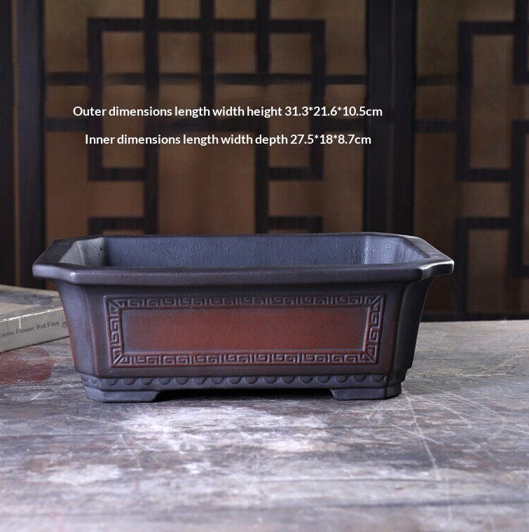 Dimension photograph of the dark rectangular pot with patterned side border