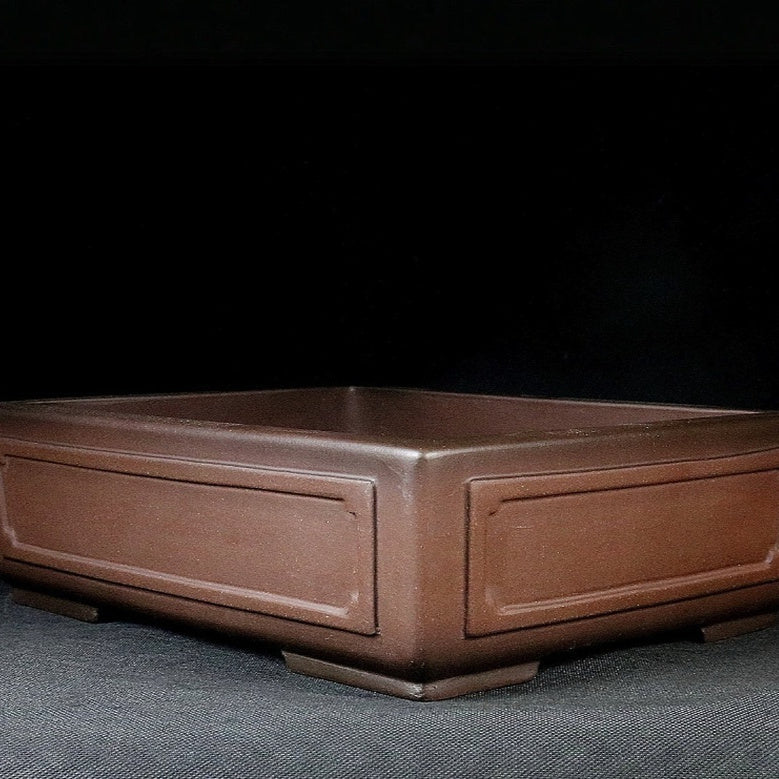 Brown rectangular pot with recessed framed panels