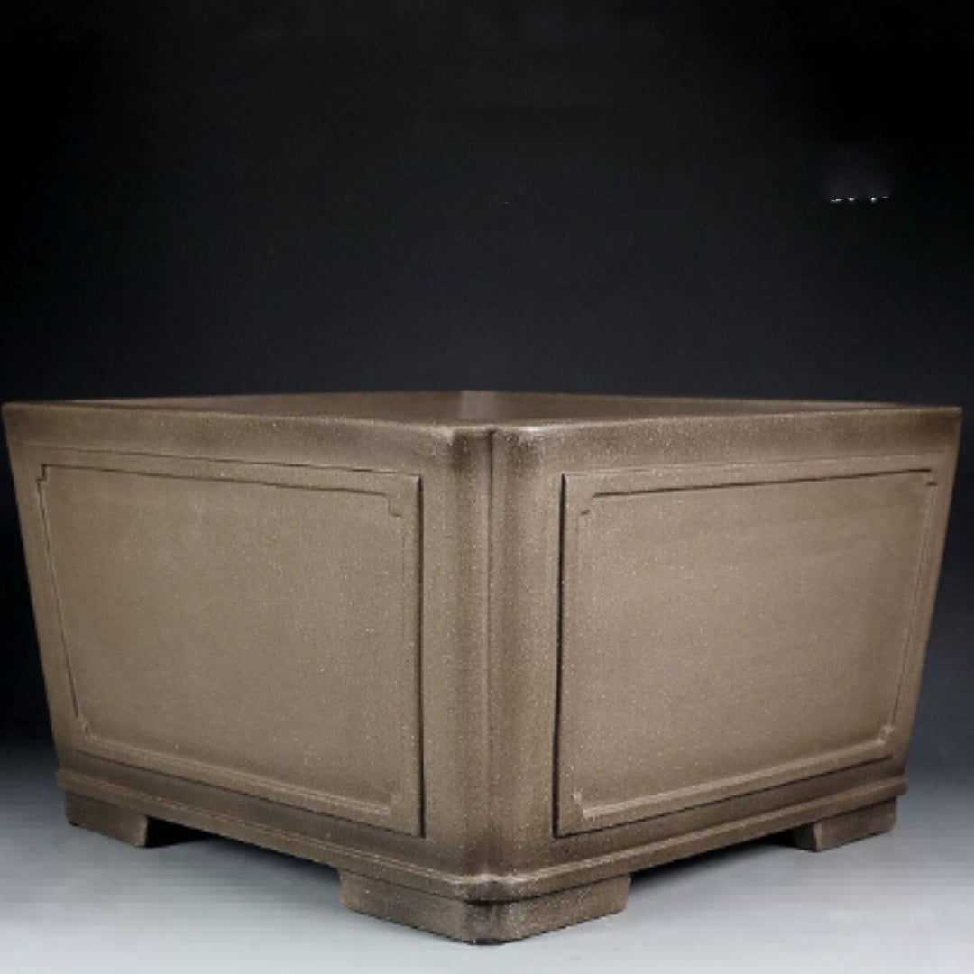 Deep taupe square bonsai pot with framed panels and block feet