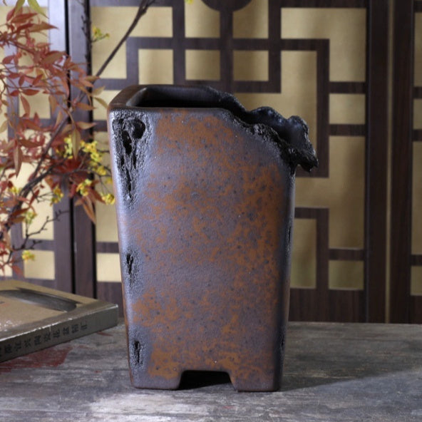 Tall mottled brown cascade pot with rough sculpted rim