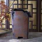 Tall mottled brown cascade pot with rough sculpted rim