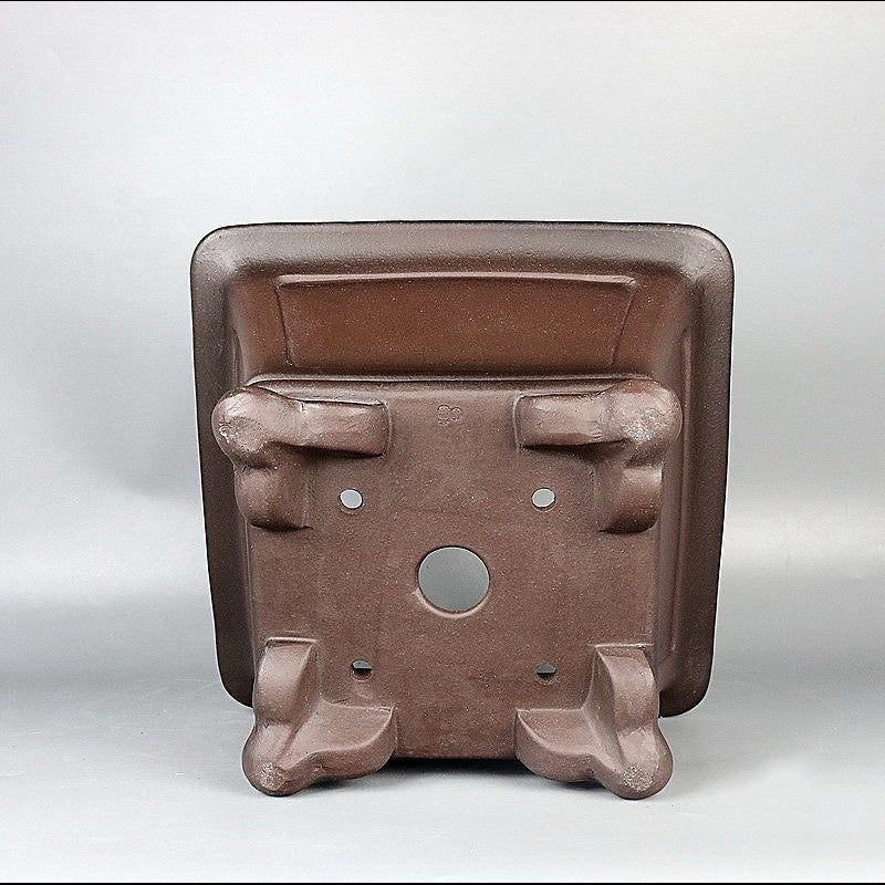Square Yixing pot underside and decorative feet