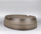 Taupe oval pot upside down showing its banded walls