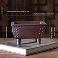 Brown rectangular bonsai pot with studded corners and tall feet, with exterior and interior measurement labels