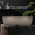 Banded taupe oval pot with dimension labels on a display surface