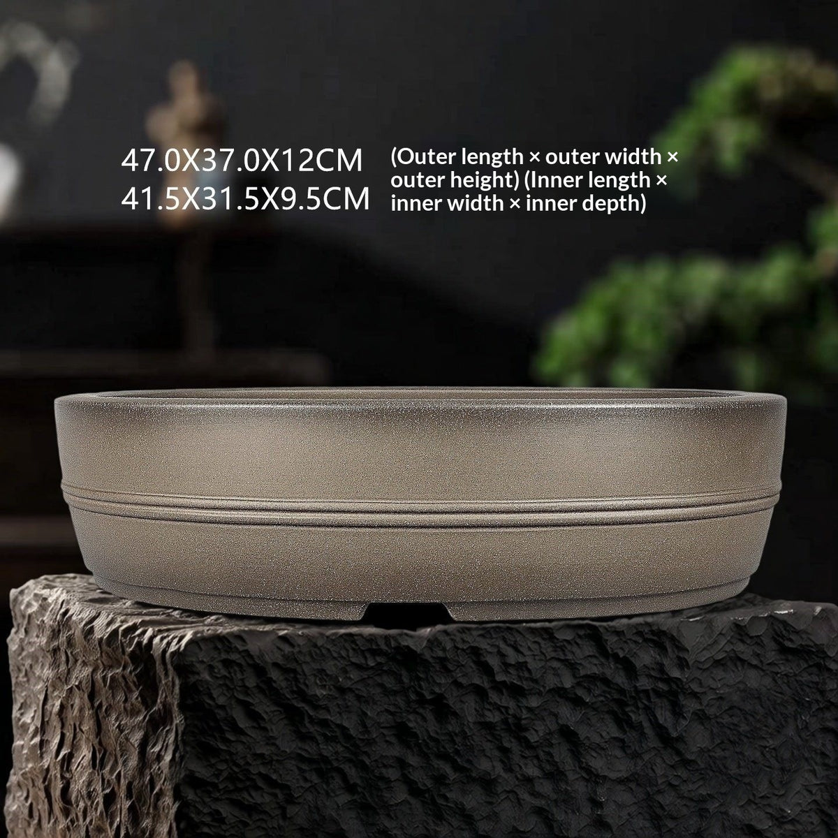 Banded taupe oval pot with dimension labels on a display surface