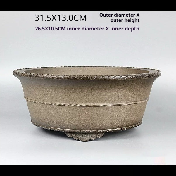 Taupe round bonsai pot with sculpted front foot and measurement labels