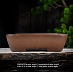 Plain brown rectangular pot with low cutout feet and size labels