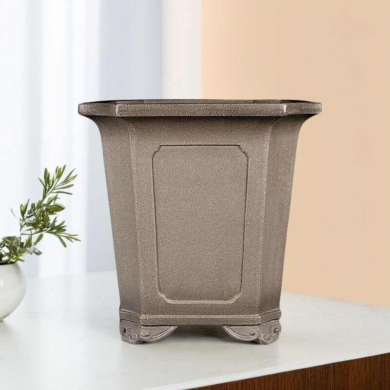 Tall taupe square pot with framed panels and curled feet