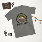 charcoal gray T-shirt with green bonsai and pirate skull graphic inside a black circle with Bonsai Life Co. lettering, white Halloween flat lay